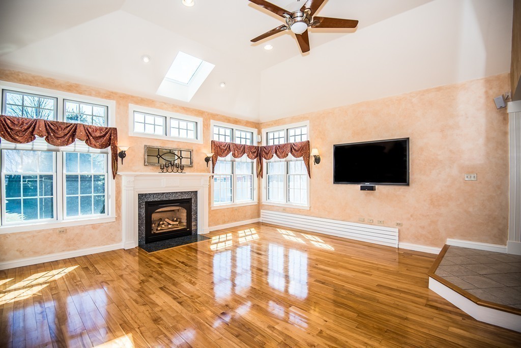 5 Twin Brooks Road Salisbury, MA 01952 - Photo 19 of 30 a living room with furniture and a flat screen tv