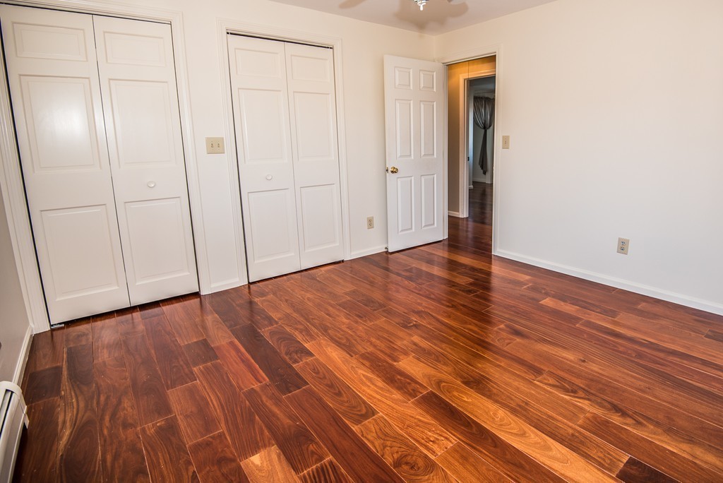 5 Twin Brooks Road Salisbury, MA 01952 - Photo 24 of 30 a view of an empty room with wooden floor