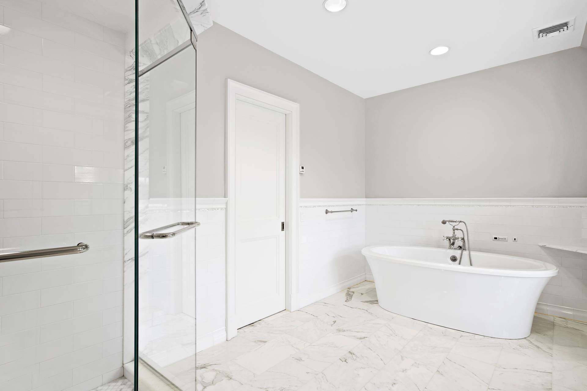 Undisclosed Address Water Mill, NY 11976 - Photo 11 of 26 a bathroom with a white tub shower and vanity
