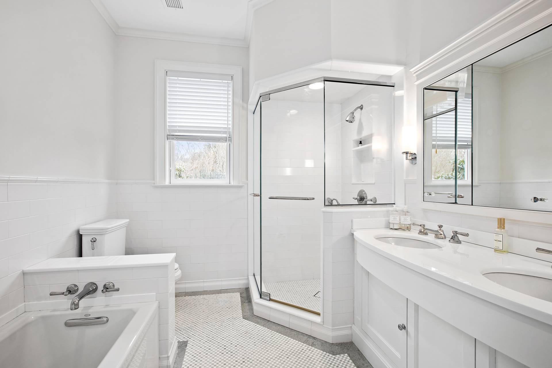 Undisclosed Address Water Mill, NY 11976 - Photo 13 of 26 a bathroom with a sink a mirror and a bathtub