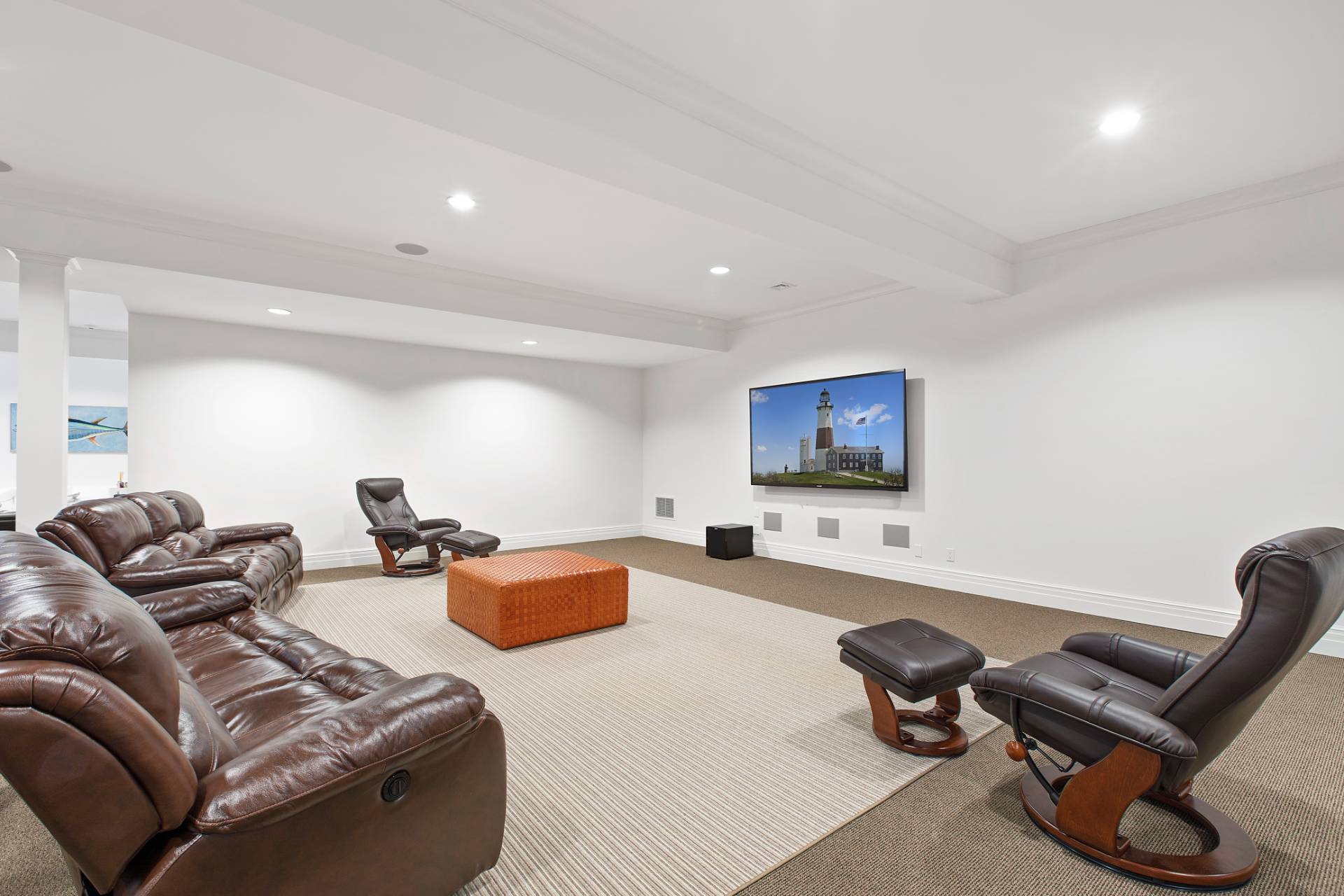 Undisclosed Address Water Mill, NY 11976 - Photo 22 of 26 a living room with furniture a couch and a flat screen tv