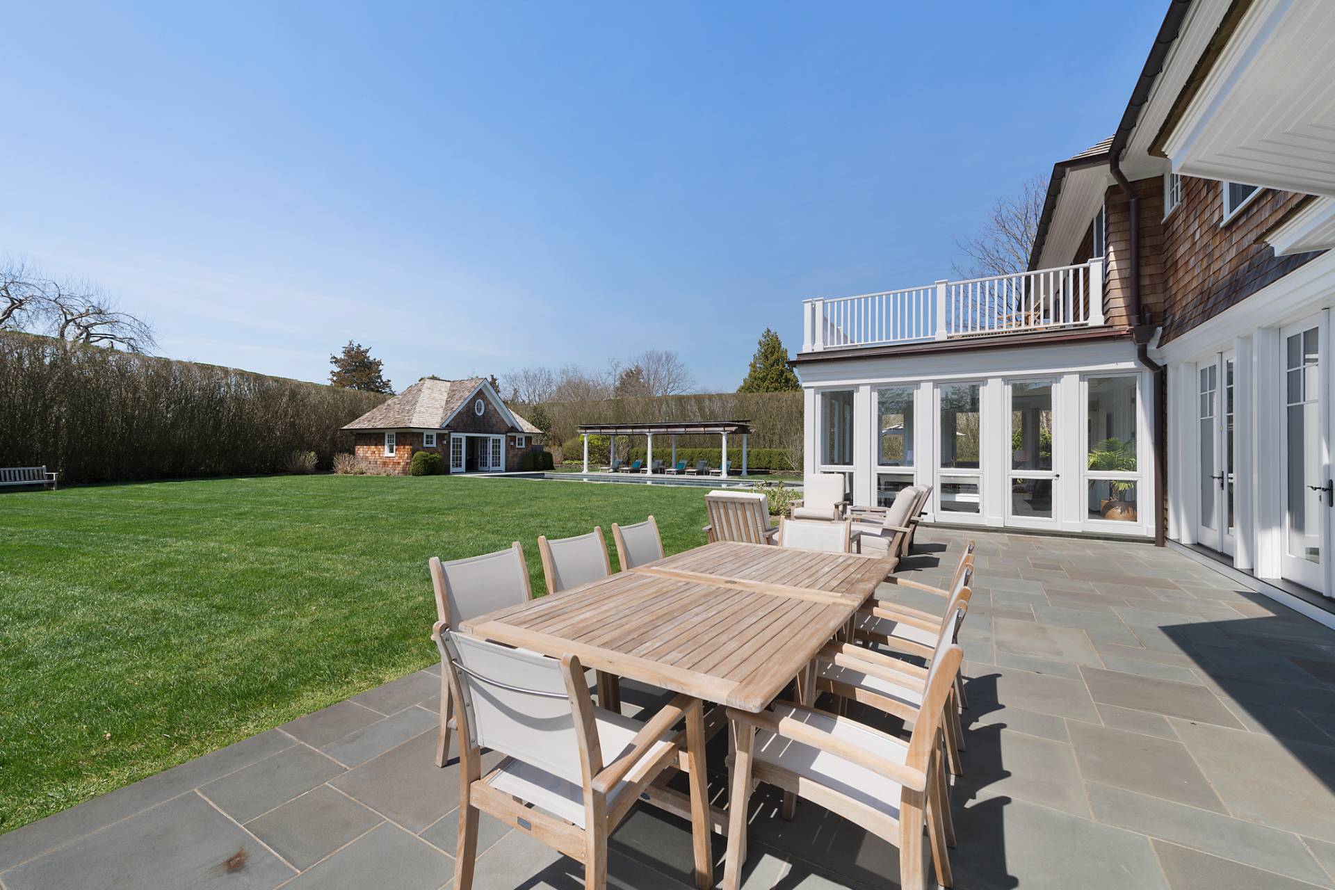 Undisclosed Address Water Mill, NY 11976 - Photo 24 of 26 a view of a house with backyard porch and sitting area