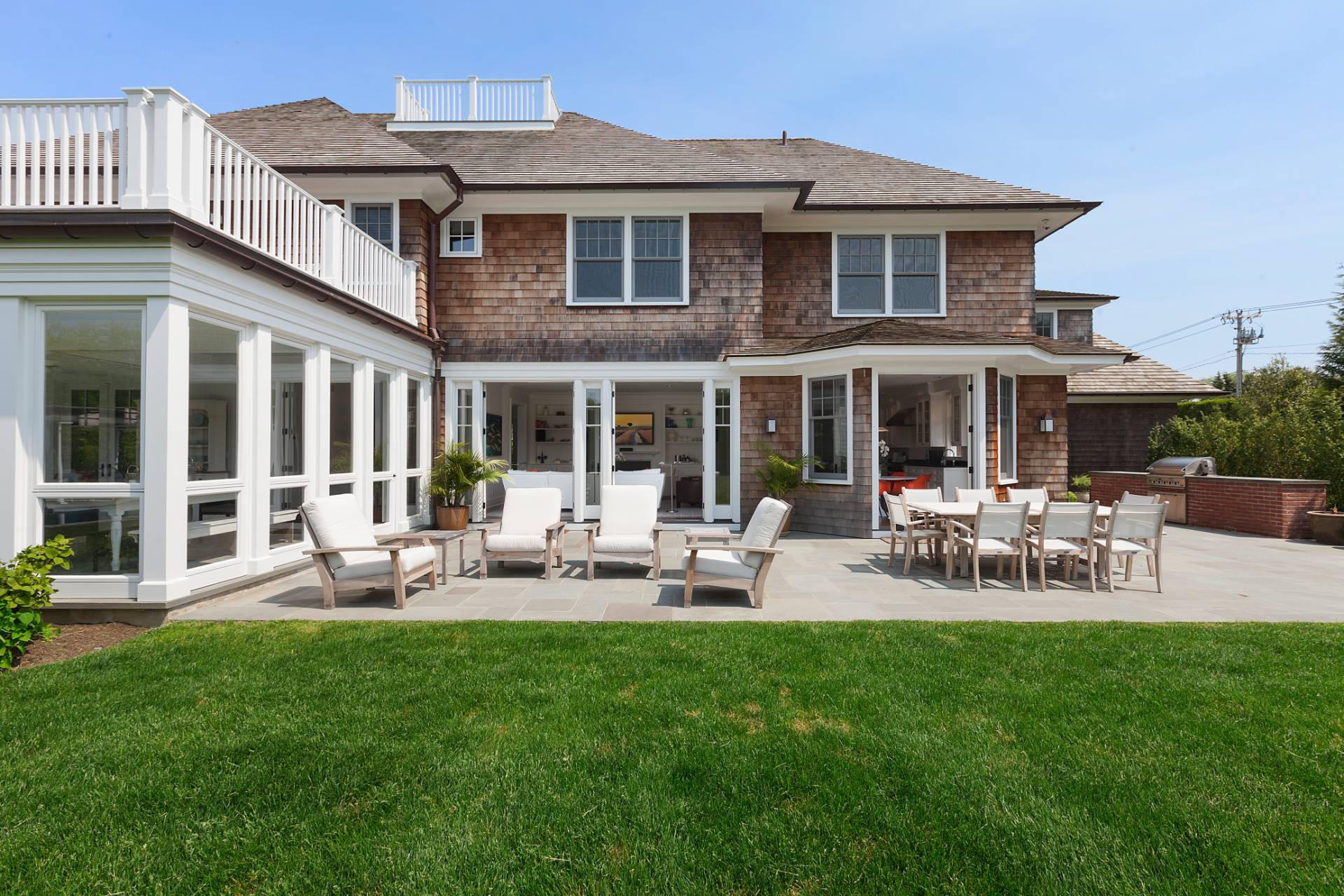 Undisclosed Address Water Mill, NY 11976 - Photo 25 of 26 a view of a house with a deck and furniture