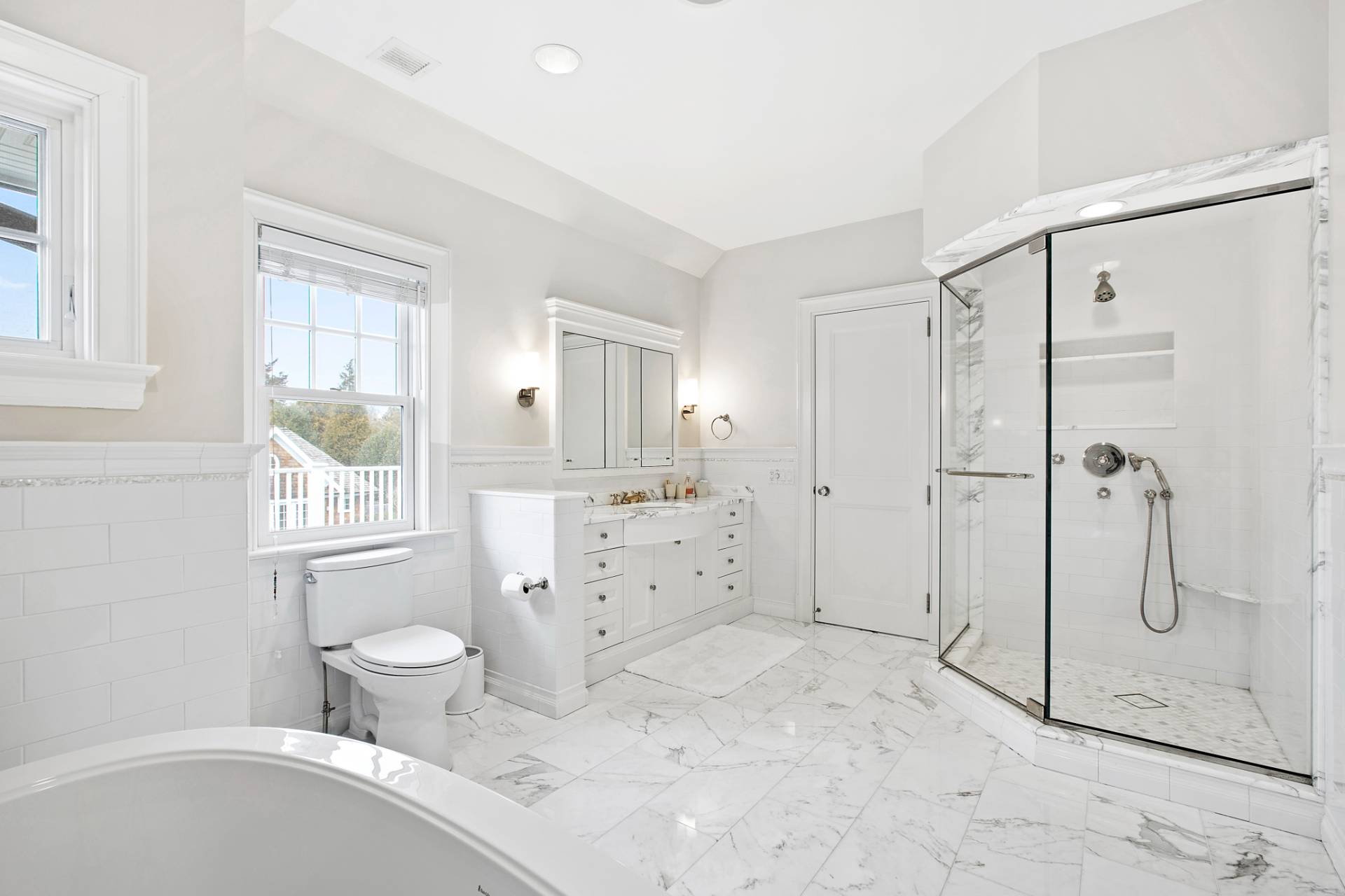Undisclosed Address Water Mill, NY 11976 - Photo 10 of 26 a bathroom with a granite countertop sink a toilet and shower