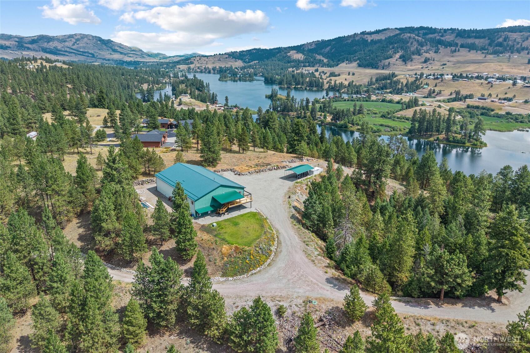 15 Miyoko Point Road Republic, WA 99166 - Photo 36 of 38 an aerial view of a house with a lake view