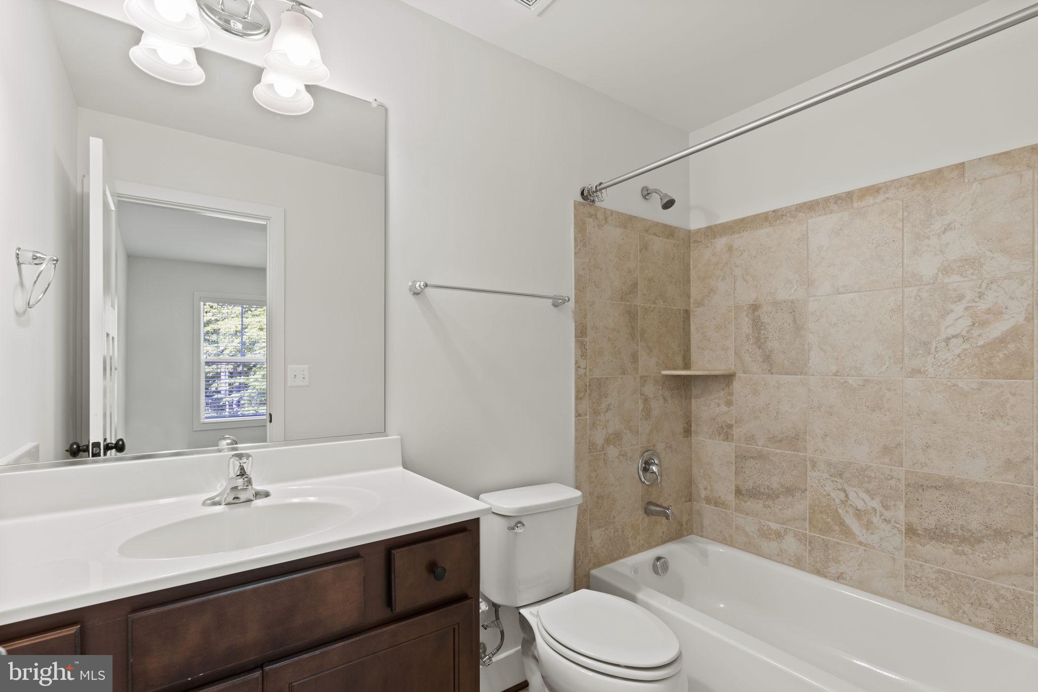 9171 Keyser Road Nokesville, VA 20181 - Photo 29 of 47 Ensuite bath features tile and tub/shower combo.