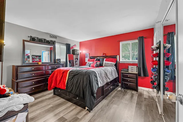 a bedroom with a bed and a dresser