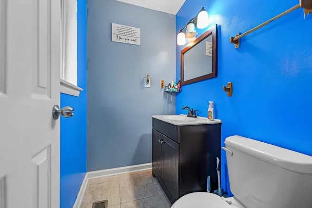 a bathroom with a toilet and a sink