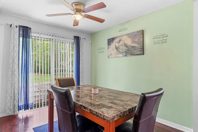 a view of a dining room with furniture window and wooden floor
