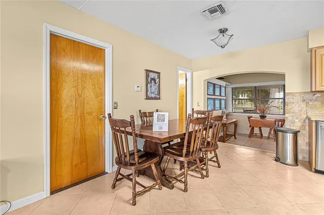 a view of a dining room with furniture and a livingroom