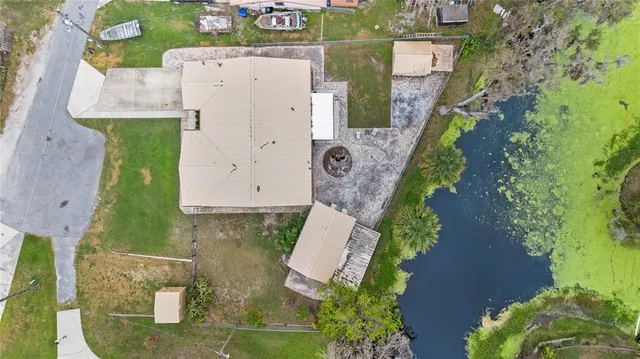 a view of a house with swimming pool and sitting area