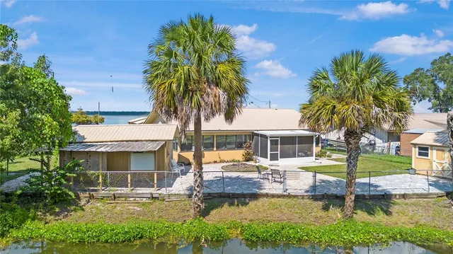 an aerial view of a houses with a lake view