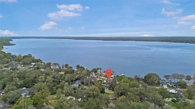 a view of a houses with a yard