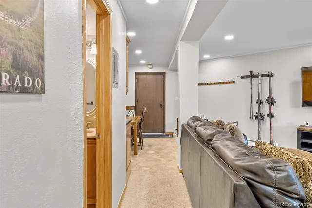 a en suite bathroom with a granite countertop sink and a mirror