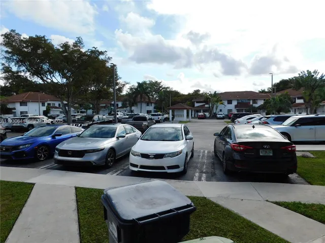 a car parked in parking lot of a house