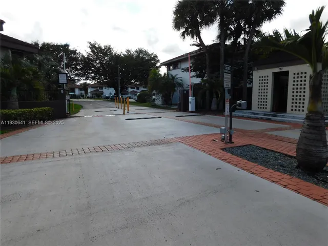 a sign board that has a tree on the side of it