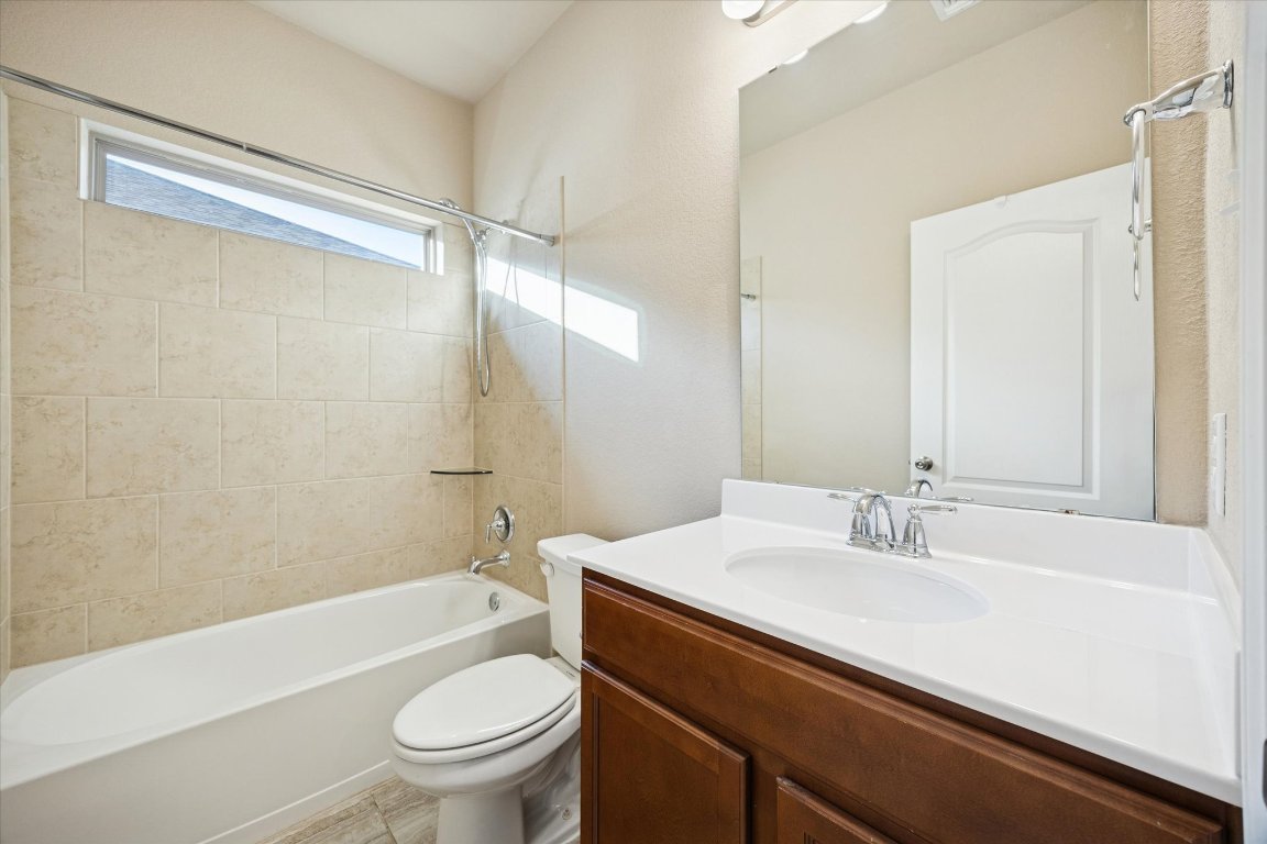 7517 Hickman Street Temple, TX 76502 - Photo 12 of 16 a bathroom with a sink a toilet and shower