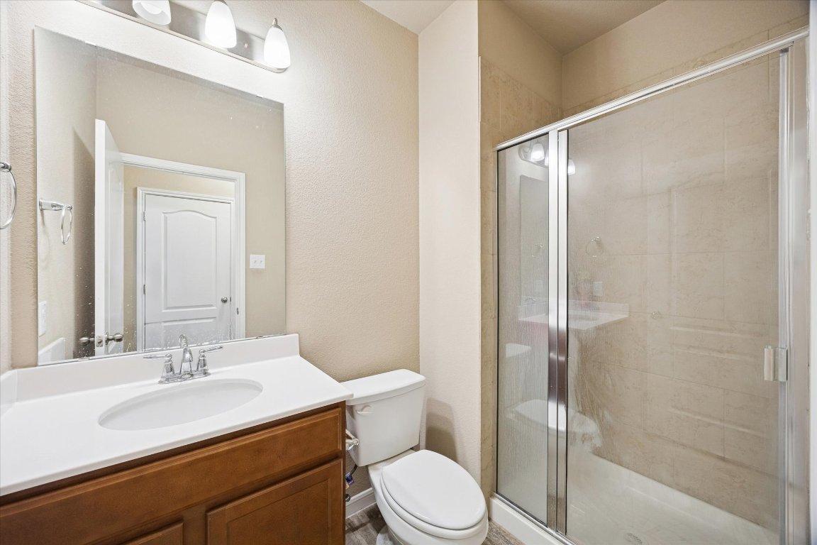 7517 Hickman Street Temple, TX 76502 - Photo 14 of 16 a bathroom with a sink toilet and shower