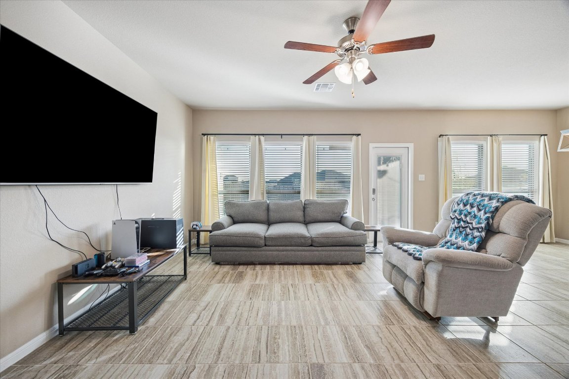 7517 Hickman Street Temple, TX 76502 - Photo 5 of 16 a living room with furniture and a flat screen tv