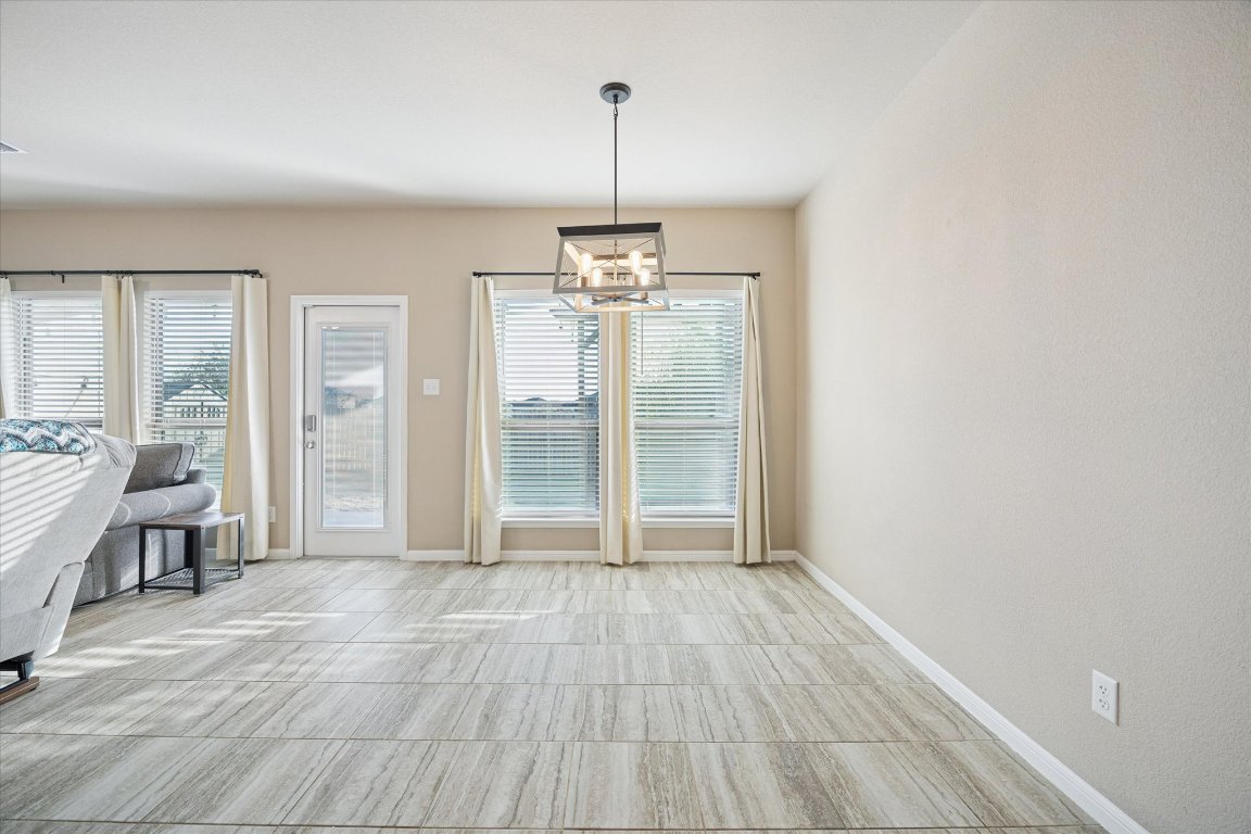 7517 Hickman Street Temple, TX 76502 - Photo 6 of 16 a view of empty room with wooden floor and fan