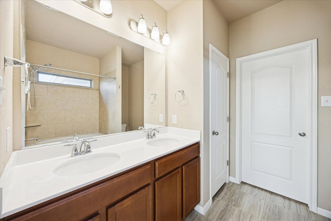 7517 Hickman Street Temple, TX 76502 - Photo 9 of 16 a bathroom with a sink double vanity and a mirror