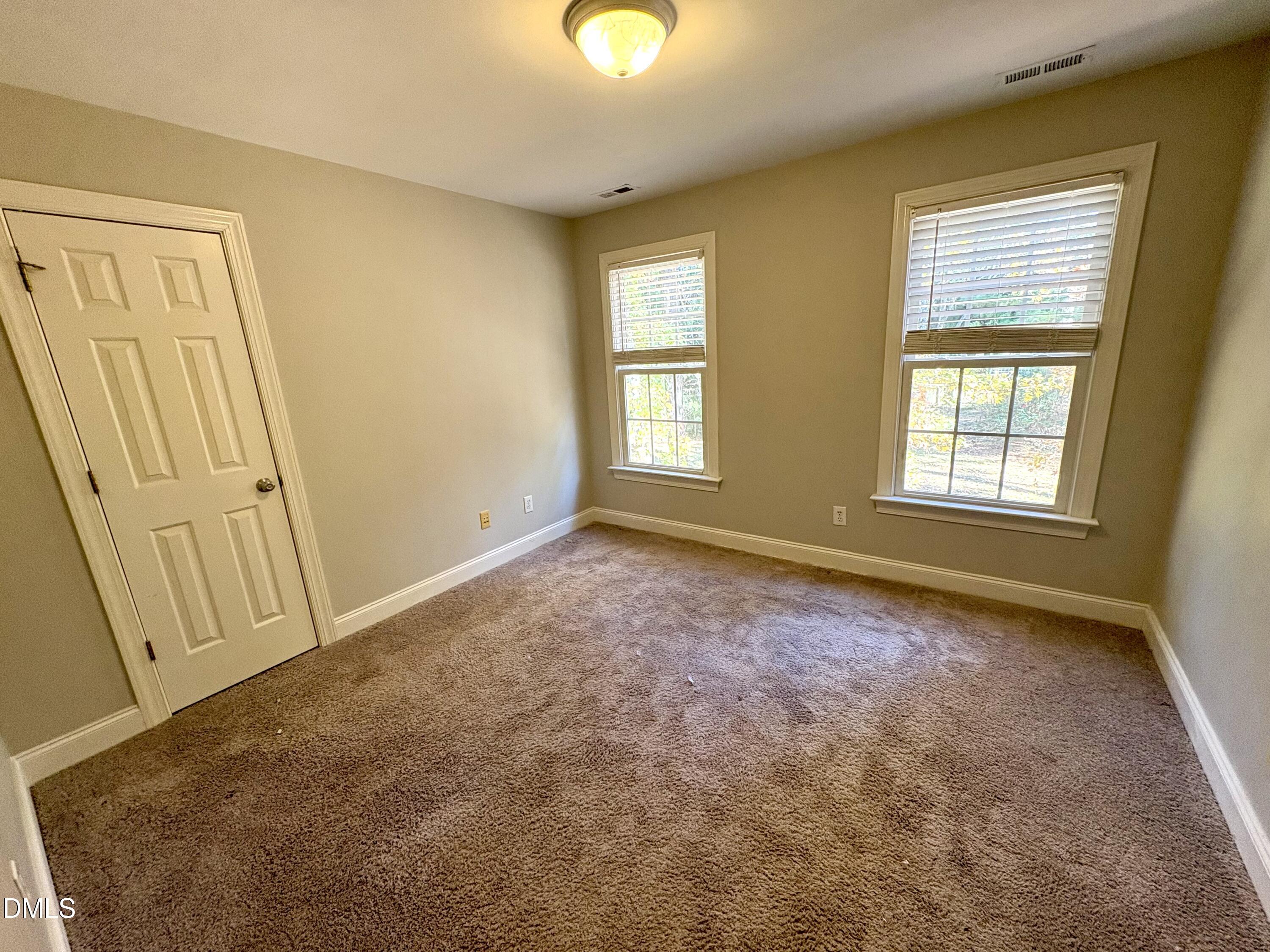 3304 Drexel Hill Court Apex, NC 27539 - Photo 13 of 20 an empty room with windows