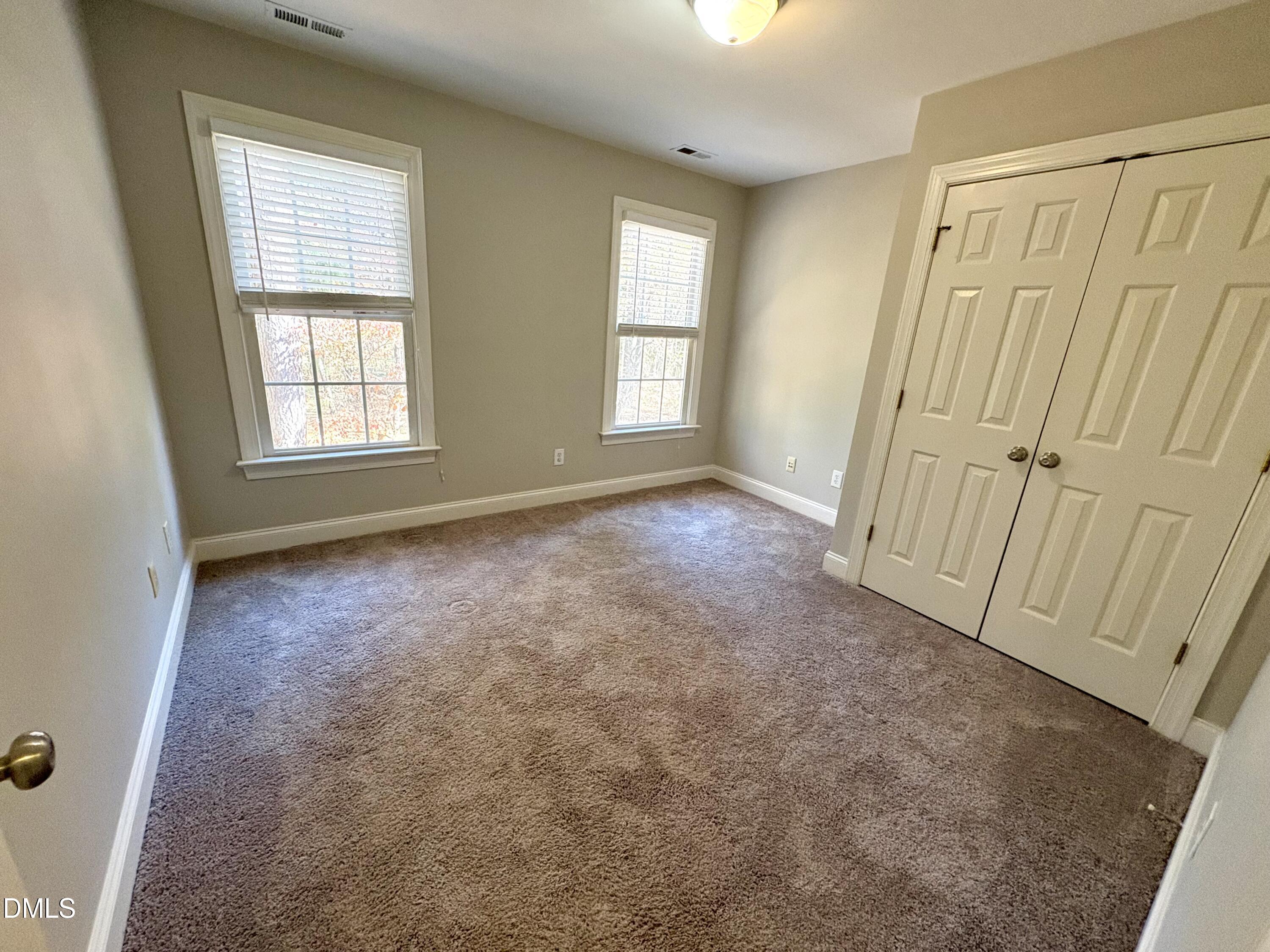 3304 Drexel Hill Court Apex, NC 27539 - Photo 14 of 20 an empty room with windows