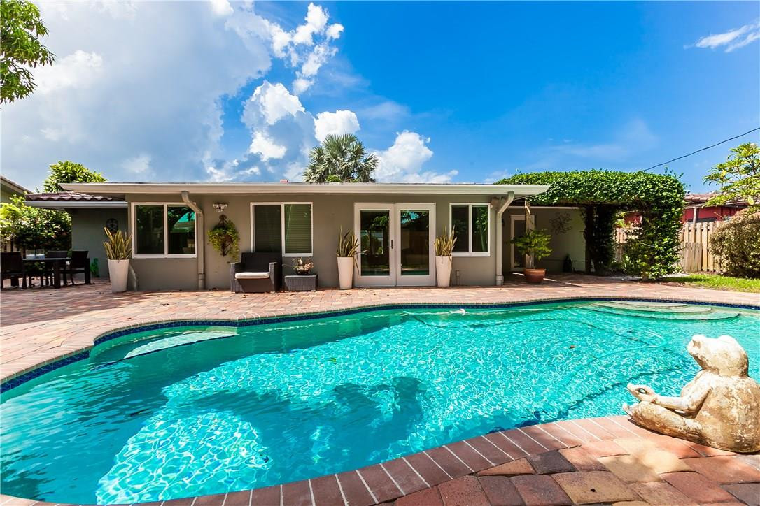 1260 Southwest 4th Street Boca Raton, FL 33486 - Photo 3 of 21 a view of a house with backyard porch and sitting area