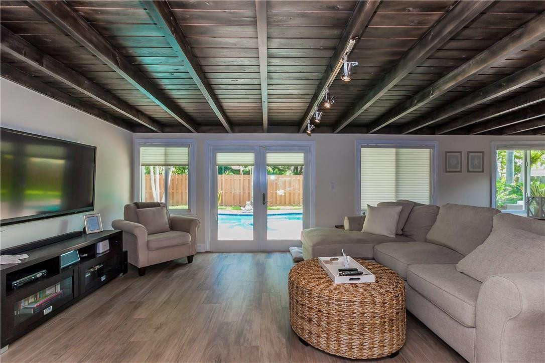 1260 Southwest 4th Street Boca Raton, FL 33486 - Photo 8 of 21 a living room with furniture and a flat screen tv