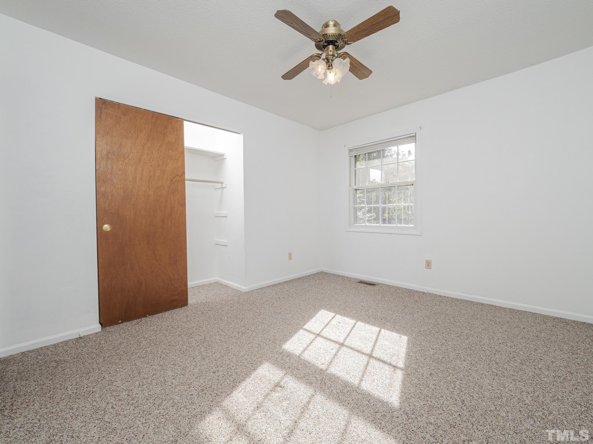 6400 Buffaloe Road Raleigh, NC 27604 - Photo 13 of 25 wooden floor in an empty room with a window