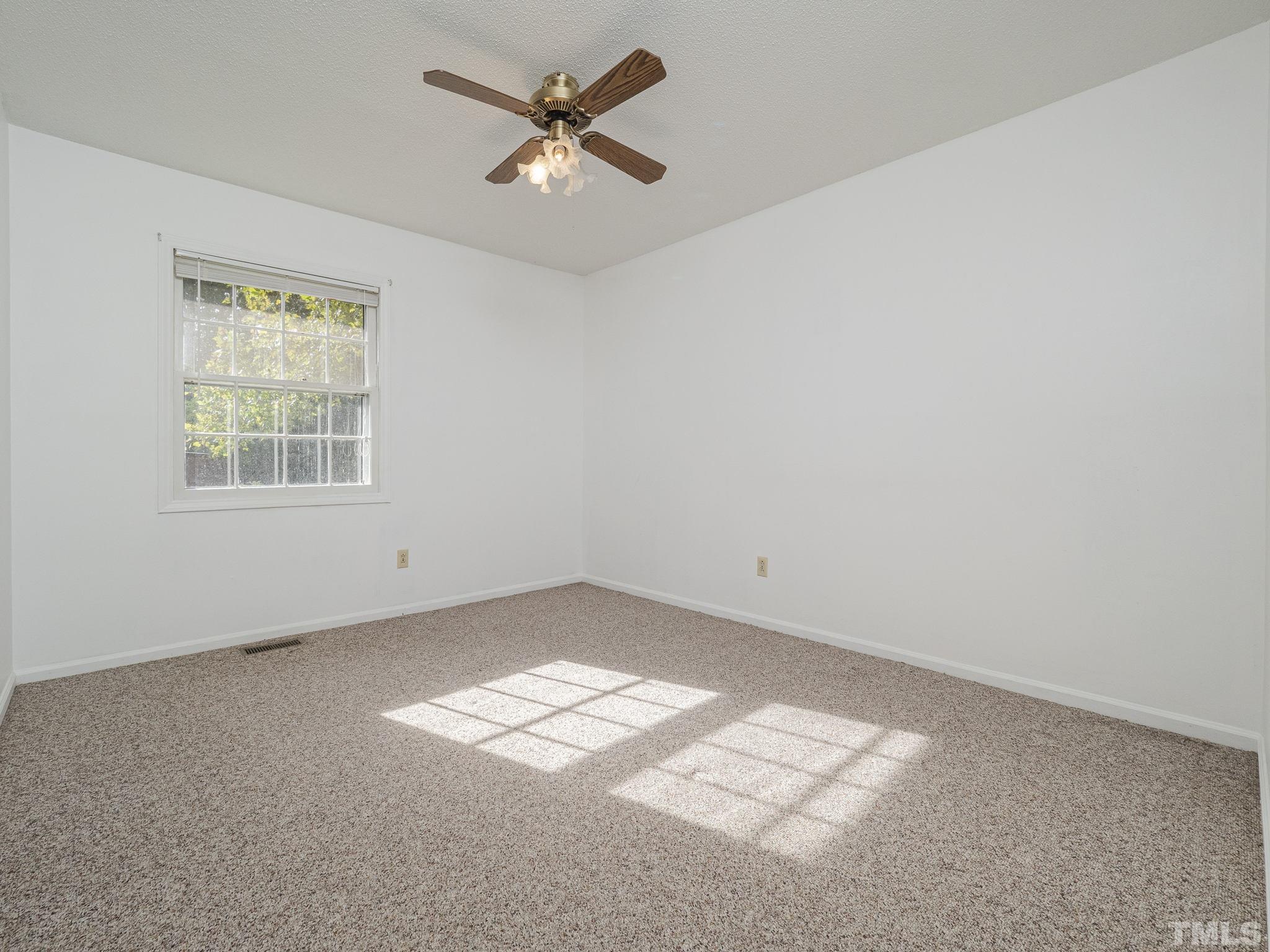 6400 Buffaloe Road Raleigh, NC 27604 - Photo 14 of 25 an empty room with a window