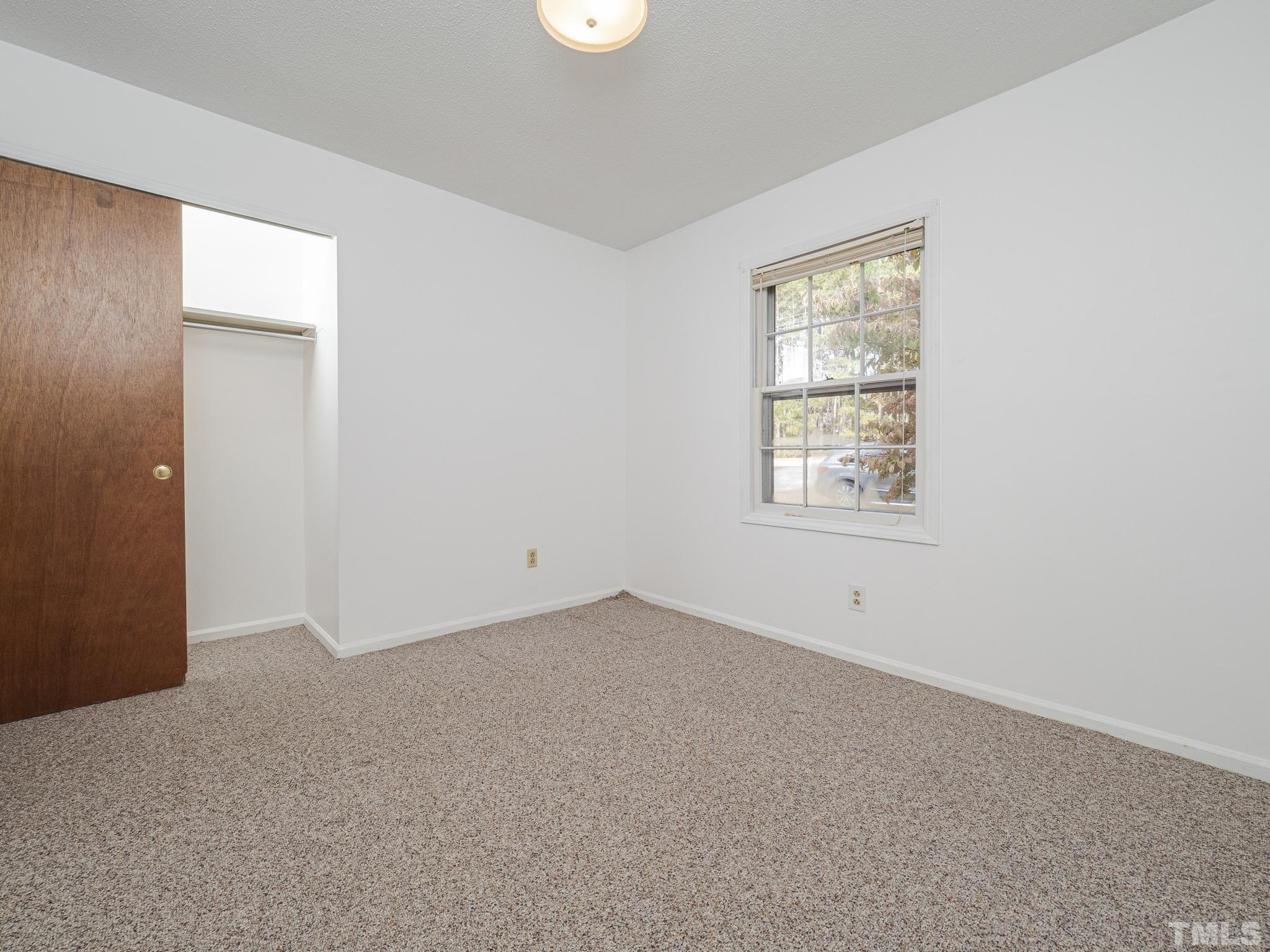 6400 Buffaloe Road Raleigh, NC 27604 - Photo 18 of 25 an empty room with windows