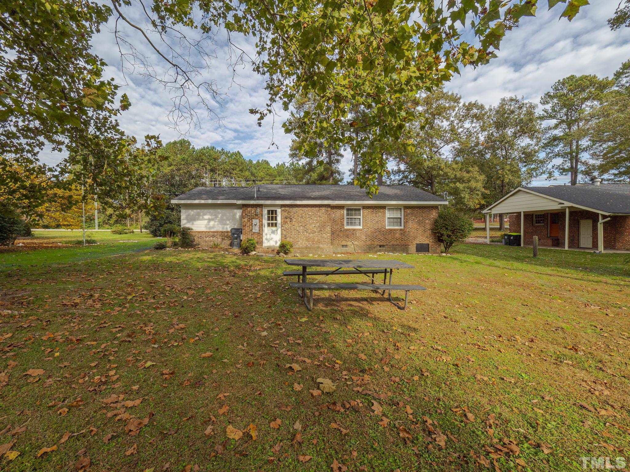 6400 Buffaloe Road Raleigh, NC 27604 - Photo 21 of 25 a view of house with garden and deck