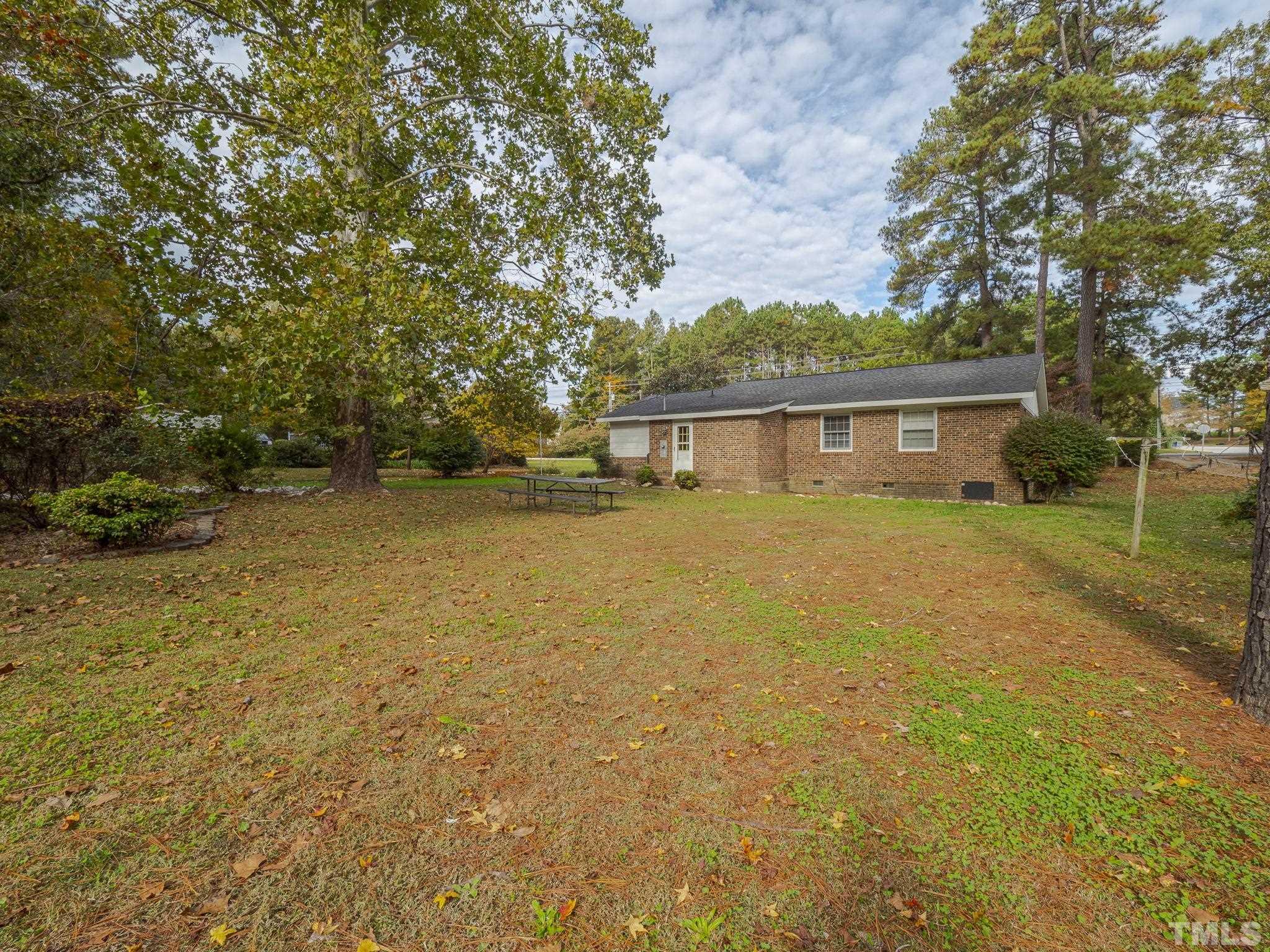 6400 Buffaloe Road Raleigh, NC 27604 - Photo 22 of 25 a view of a house with a yard