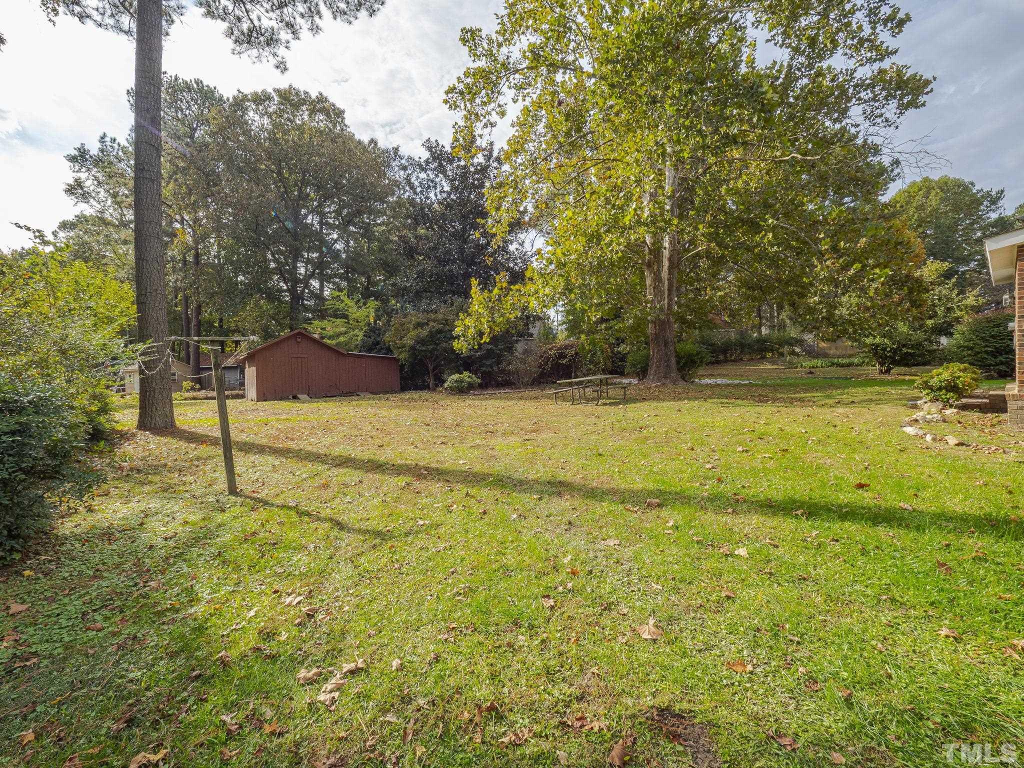 6400 Buffaloe Road Raleigh, NC 27604 - Photo 25 of 25 a view of a swimming pool with an outdoor space and seating area