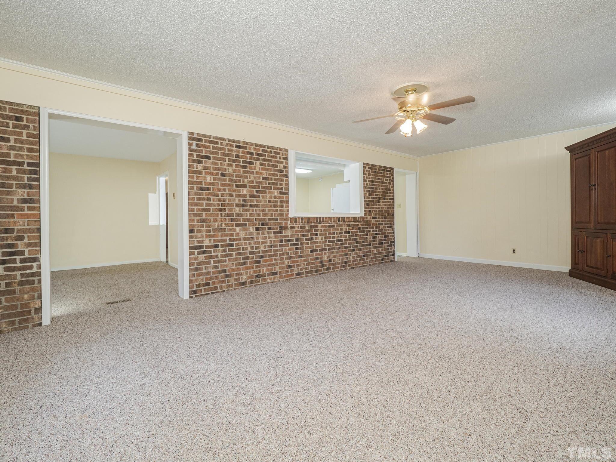6400 Buffaloe Road Raleigh, NC 27604 - Photo 4 of 25 a view of an empty room with a bathroom