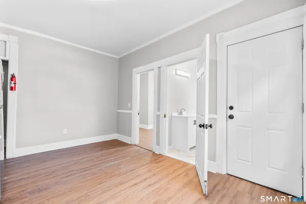 a view of a livingroom with wooden floor