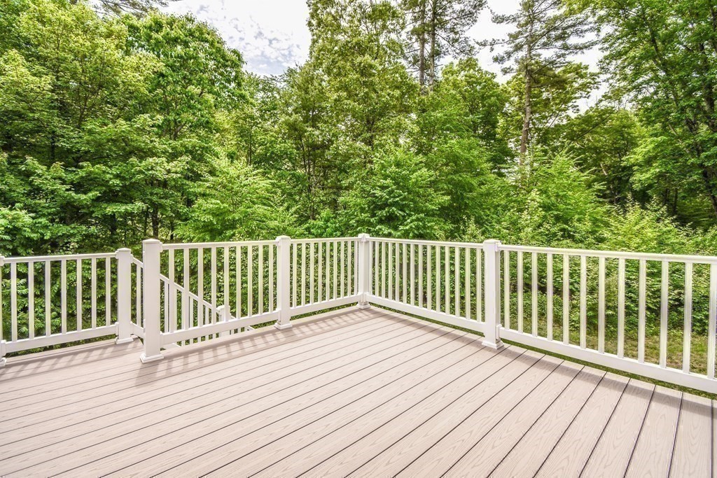 77 Dudley Road, Unit 77 Berlin, MA 01503 - Photo 26 of 30 a view of balcony with wooden floor