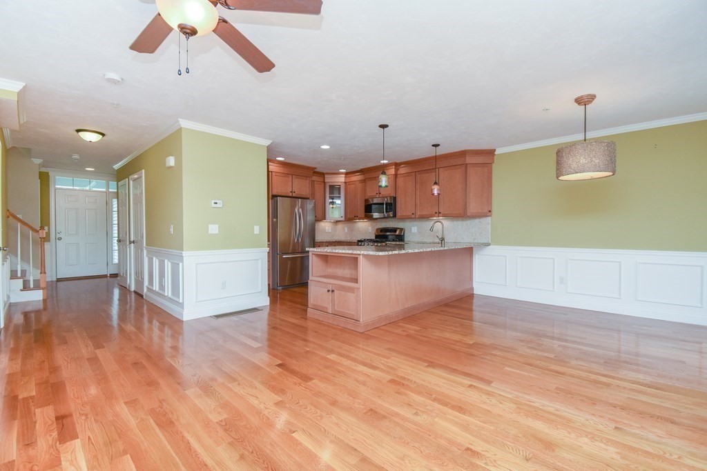 77 Dudley Road, Unit 77 Berlin, MA 01503 - Photo 8 of 30 a view of kitchen with cabinets and wooden floor