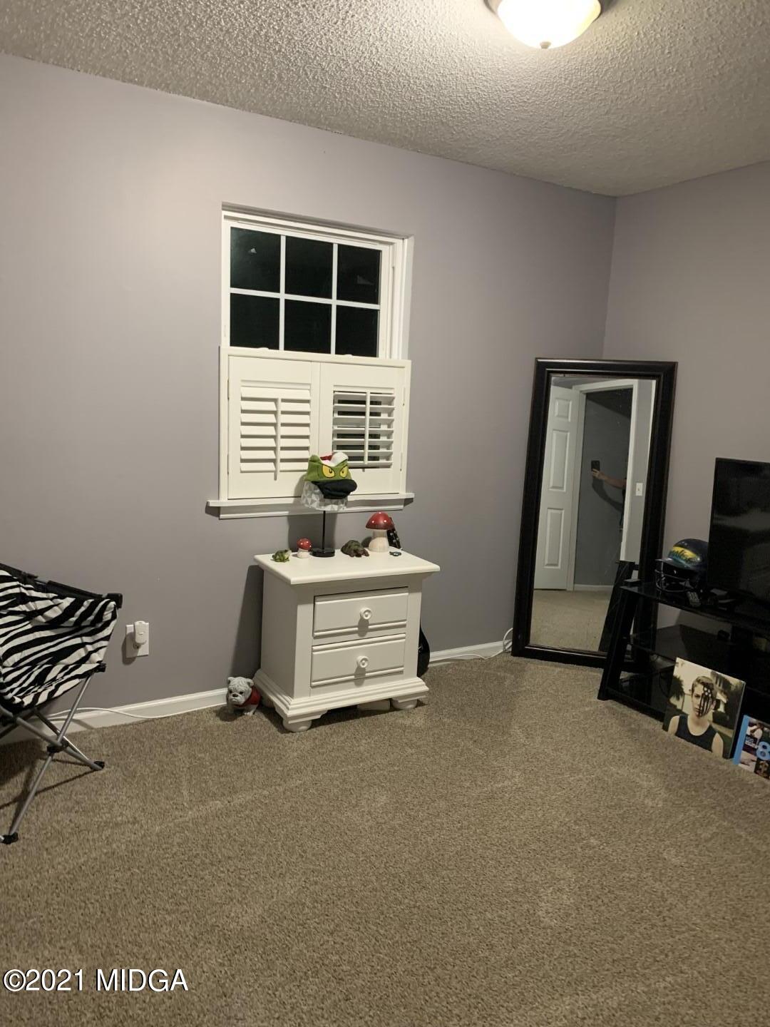 1365 Bass Road Macon, GA 31210 - Photo 12 of 15 a room with gym equipment and a window