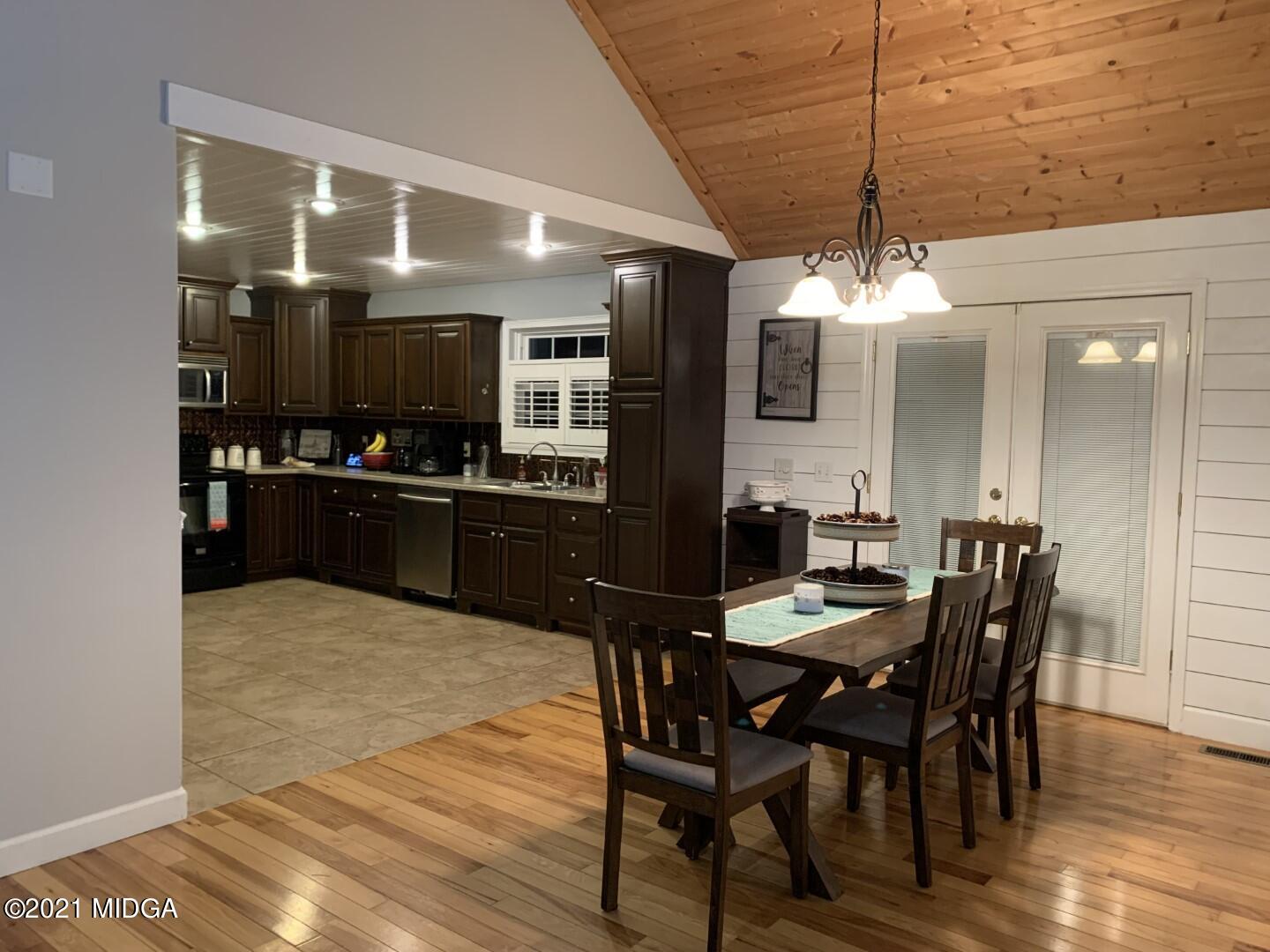 1365 Bass Road Macon, GA 31210 - Photo 4 of 15 a kitchen with a table and chairs in it