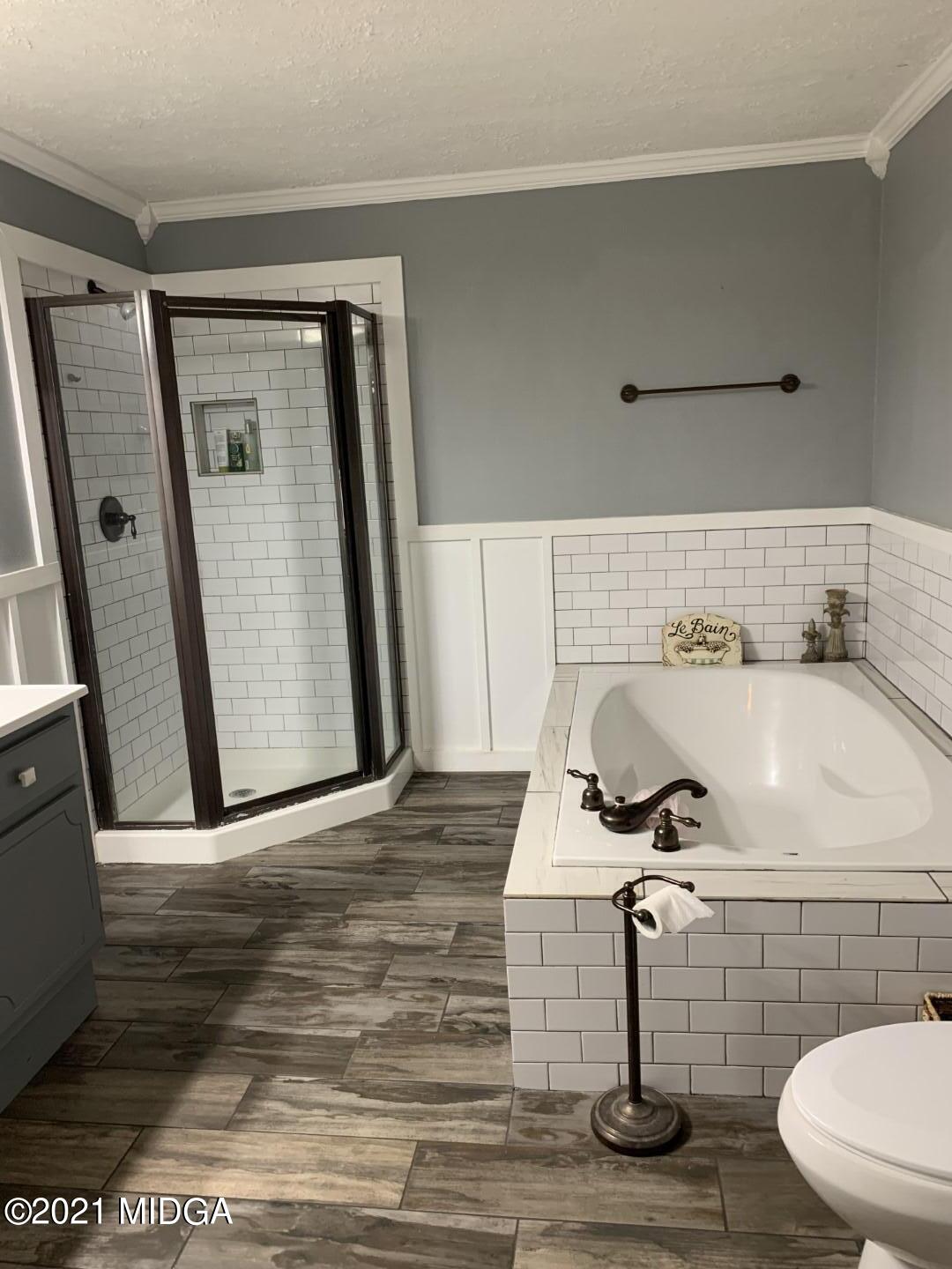 1365 Bass Road Macon, GA 31210 - Photo 10 of 15 a bathroom with a sink and mirror