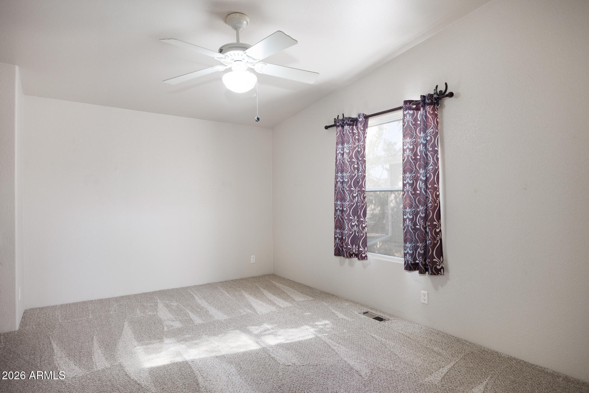 155 East Rodeo Road, Unit 77 Casa Grande, AZ 85122 - Photo 13 of 26 an empty room with windows and fan