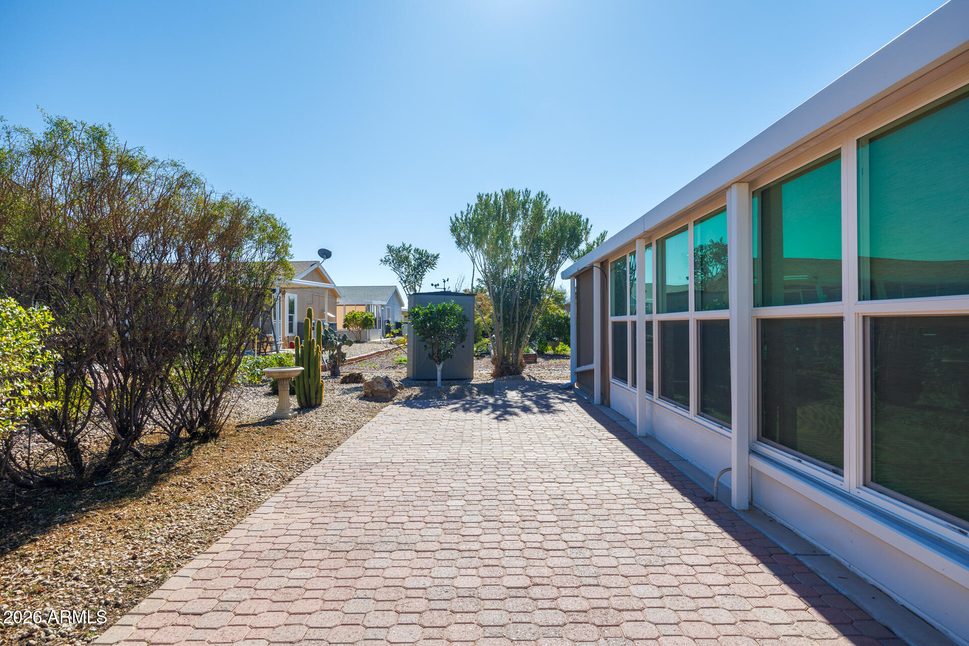 155 East Rodeo Road, Unit 77 Casa Grande, AZ 85122 - Photo 19 of 26 a view of a patio with couches table and chairs and potted plants