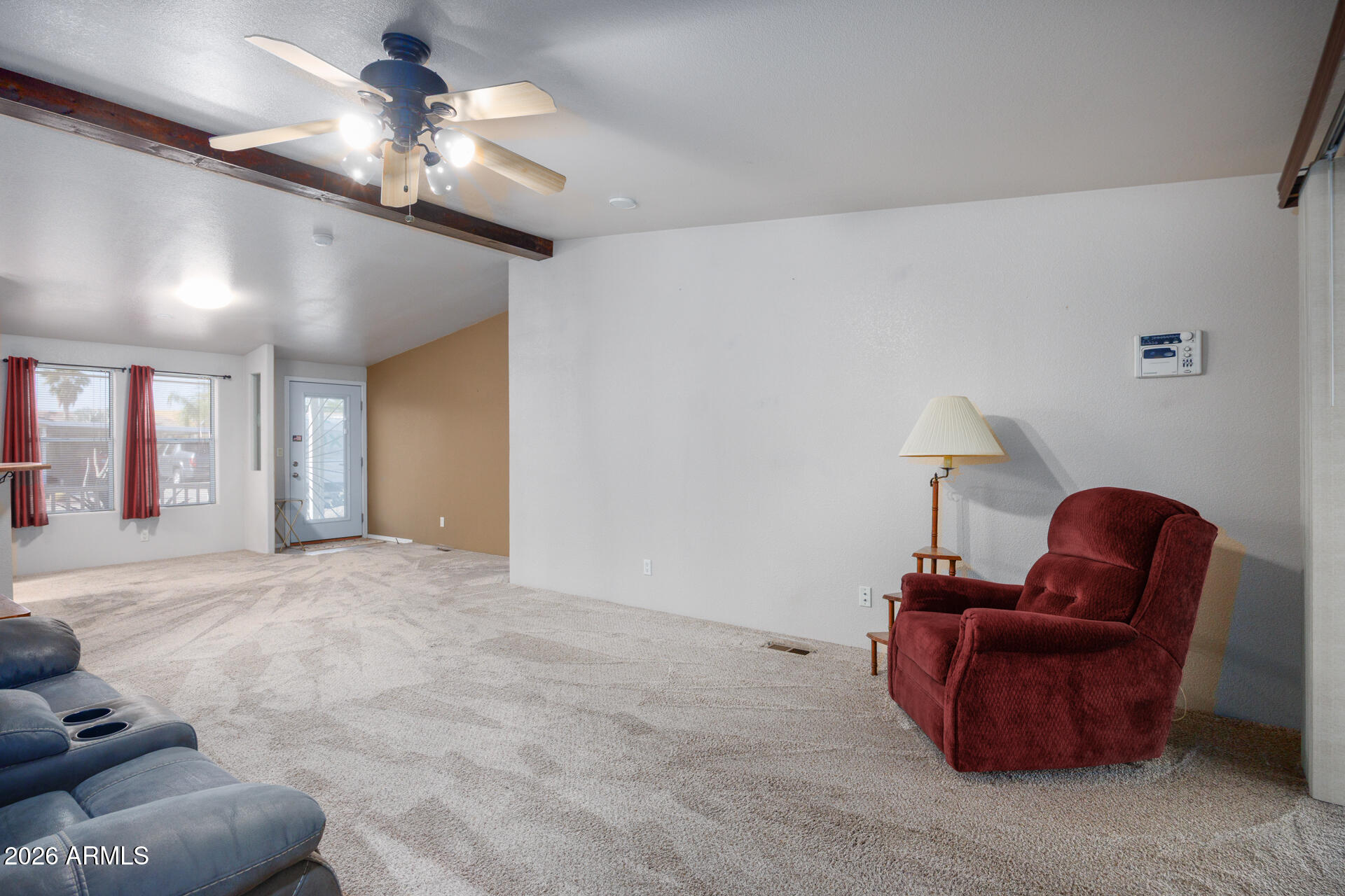 155 East Rodeo Road, Unit 77 Casa Grande, AZ 85122 - Photo 4 of 26 a living room with furniture and a chandelier