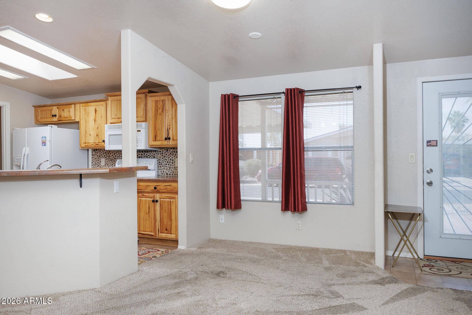 155 East Rodeo Road, Unit 77 Casa Grande, AZ 85122 - Photo 6 of 26 a view of kitchen with stainless steel appliances granite countertop cabinets and a counter top space