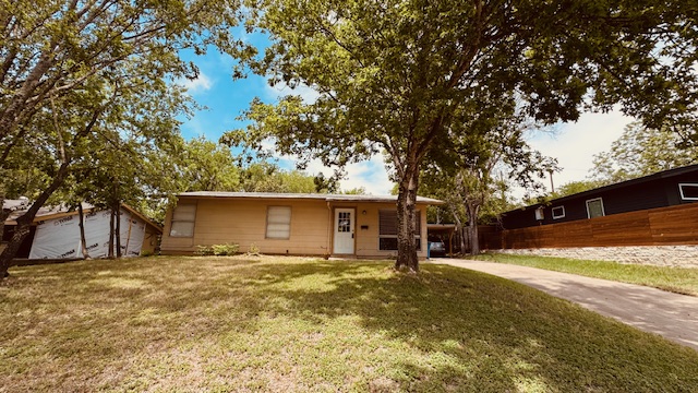 4614 Raintree Boulevard Austin, TX 78745 - Photo 14 of 14 a front view of house with yard and trees around