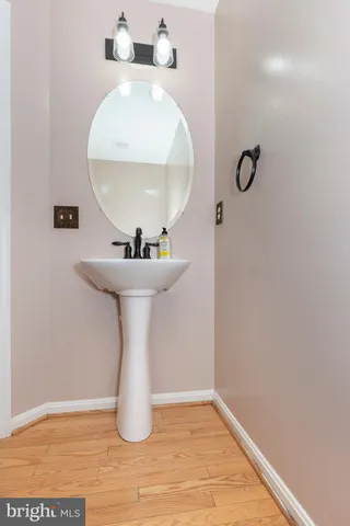 a bathroom with a sink and mirror