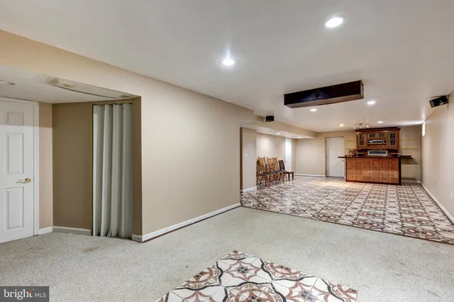 a view of kitchen with refrigerator stove and wooden floor