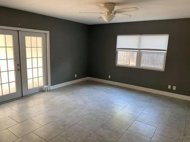 a view of an empty room with a window